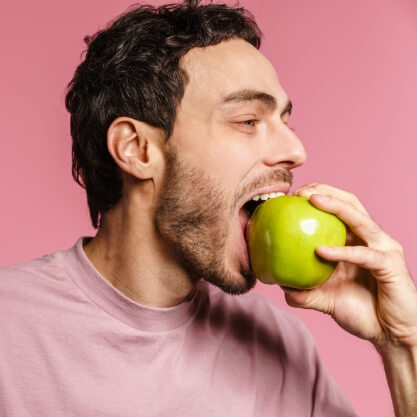 happy-handsome-unshaven-guy-eating-green-apple-2023-11-27-05-20-32-utc (2)
