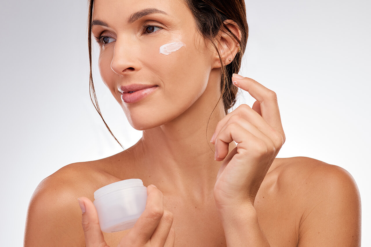 shot-of-an-attractive-young-woman-applying-moistur-2025-04-06-07-45-20-utc-1